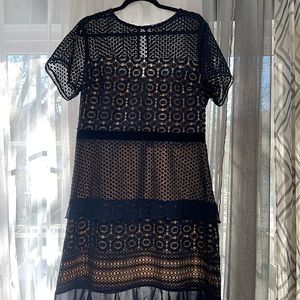 Lace and chiffon ruffle dress, trimmed at waist with velvet band. Sapphire blue